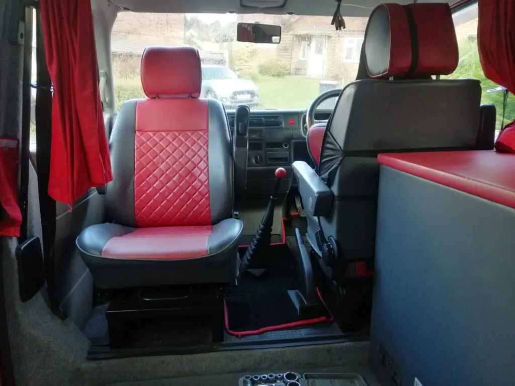 A converted van passenger seat into a swiver seat using a universal base plate